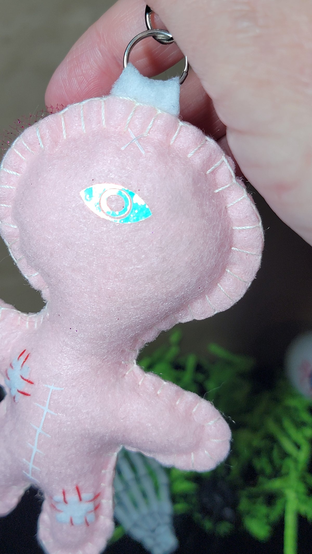 Baby pink Button-Eyed Stitchling felt keychain and bag charm, ready to ship