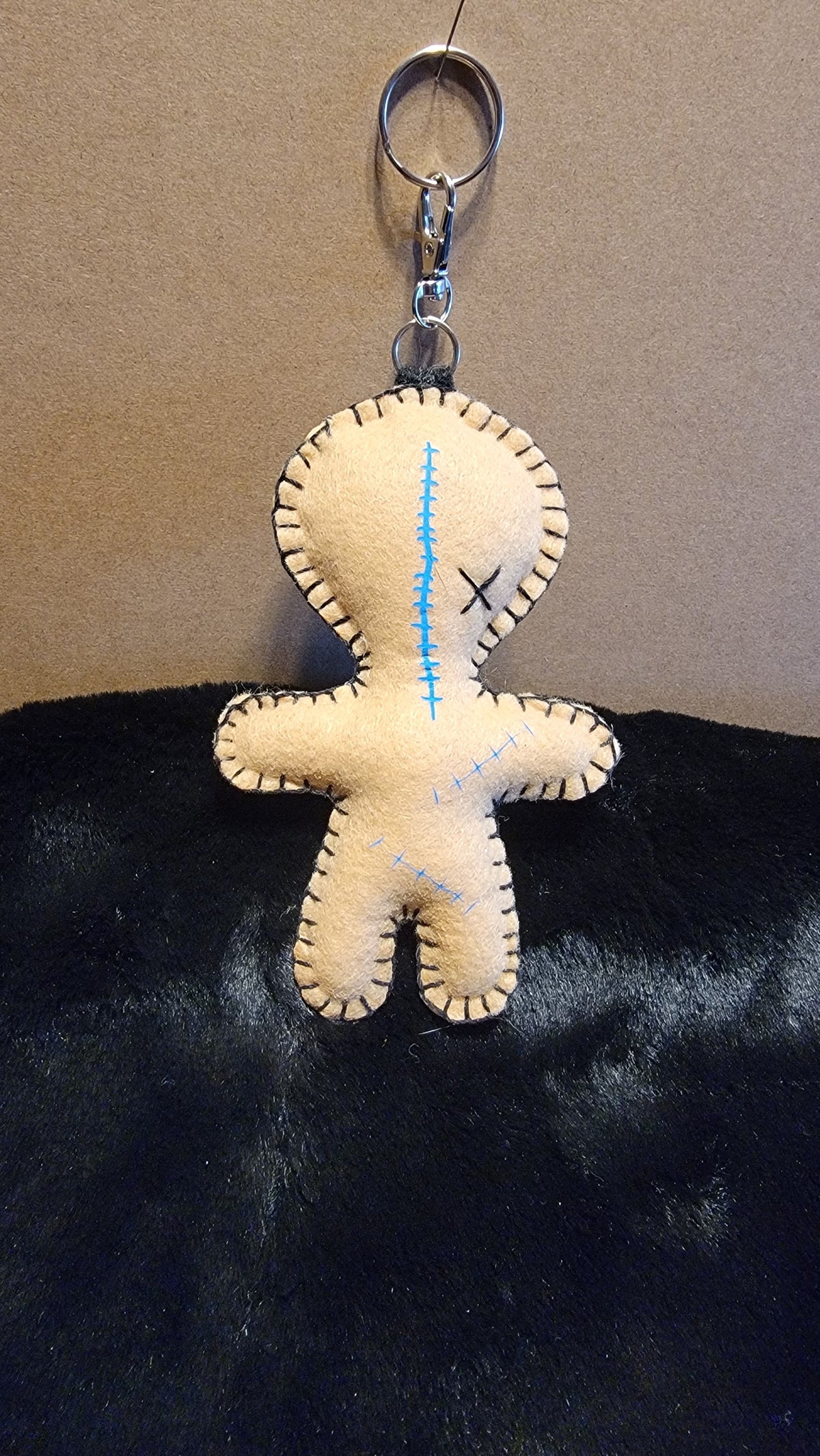 Button-Eyed Stitchling felt keychain and bag charm, ready to ship