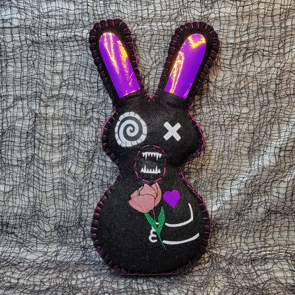Black Killer Cupid pixie bunny holding a pink flower