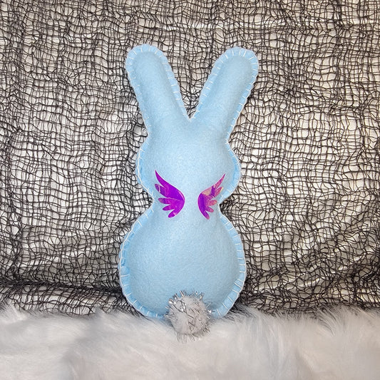 light blue colored Magic wand pixie Bunny with pink/purple Holographic accents on a textured gray background