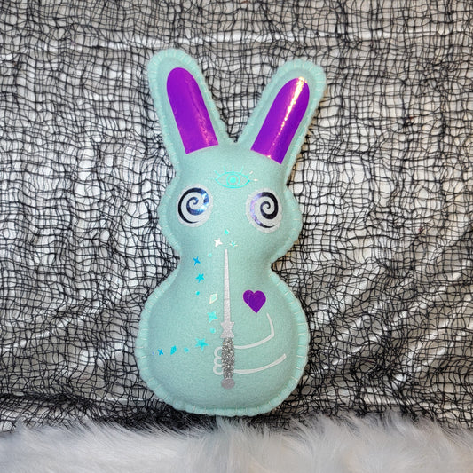 Mint Green Magic wand Pixie Bunny with Pink/purple ears on a textured black and gray background