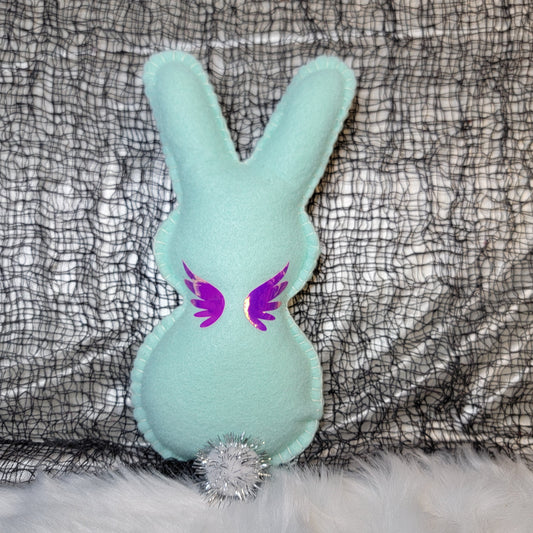 Mint Green colored Magic wand pixie Bunny with pink/purple Holographic accents on a textured gray background