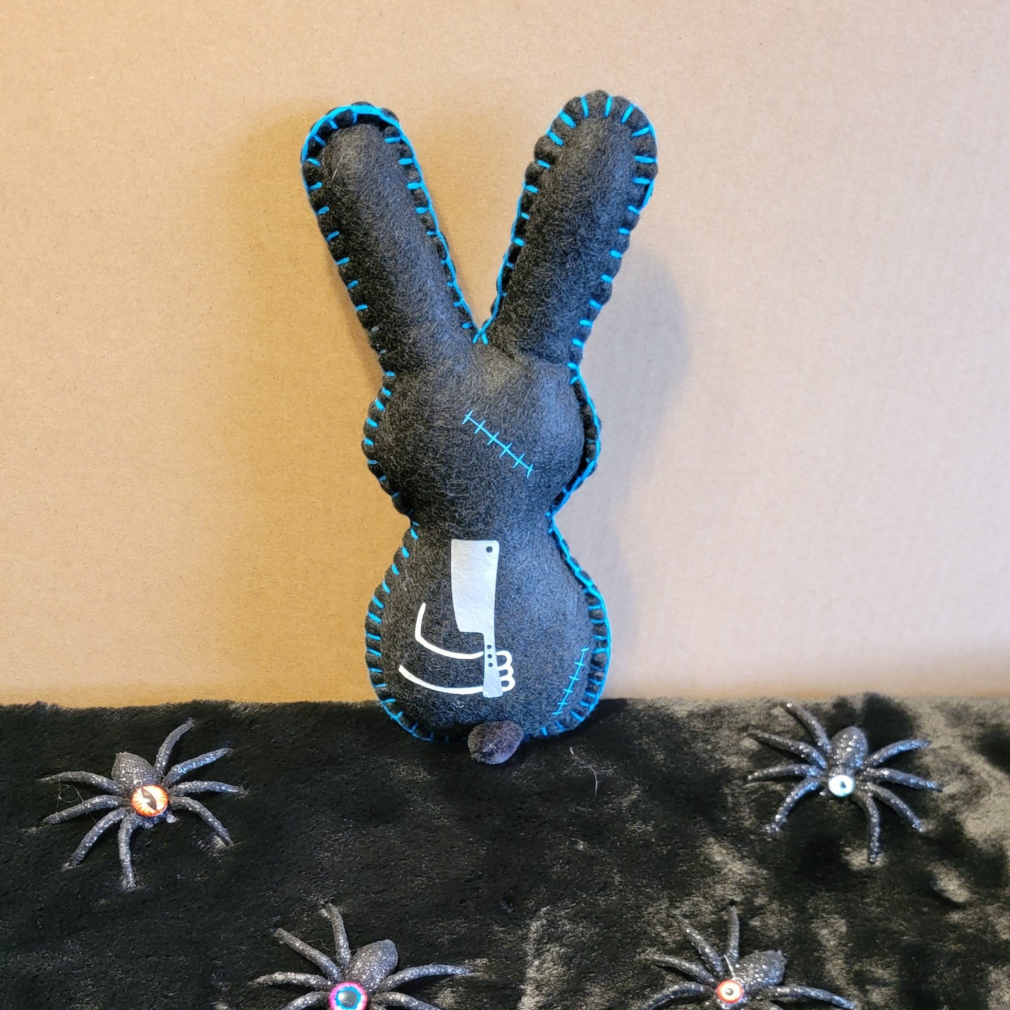 Black Zombie Bunny with Blue Stitches holding a Hatchet behind his back - Made to order