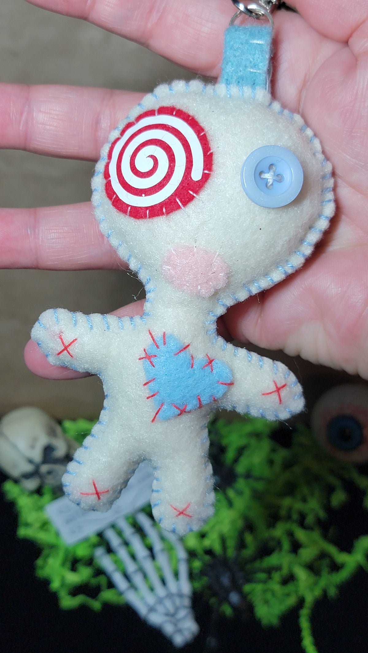 Baby blue Button-Eyed Stitchling felt keychain and bag charm, ready to ship