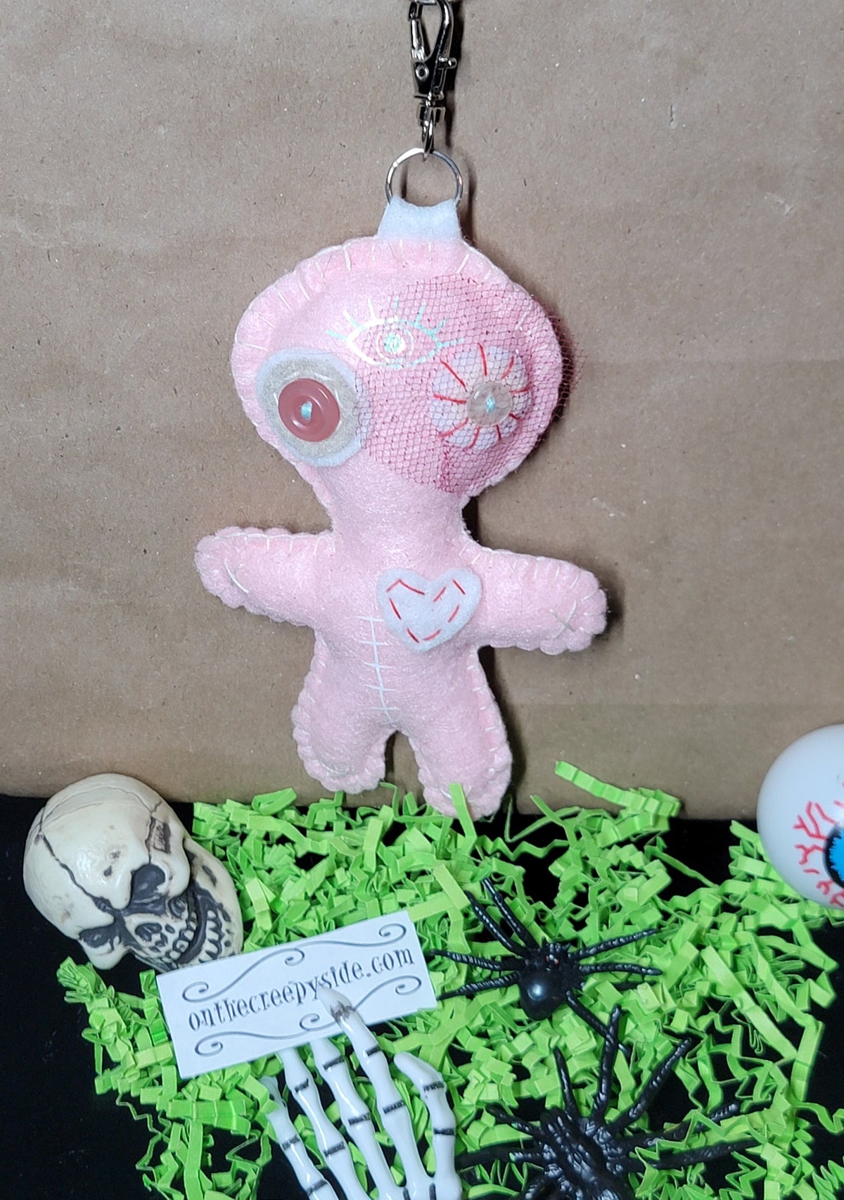 Baby pink Button-Eyed Stitchling felt plush keychain with metal keyring