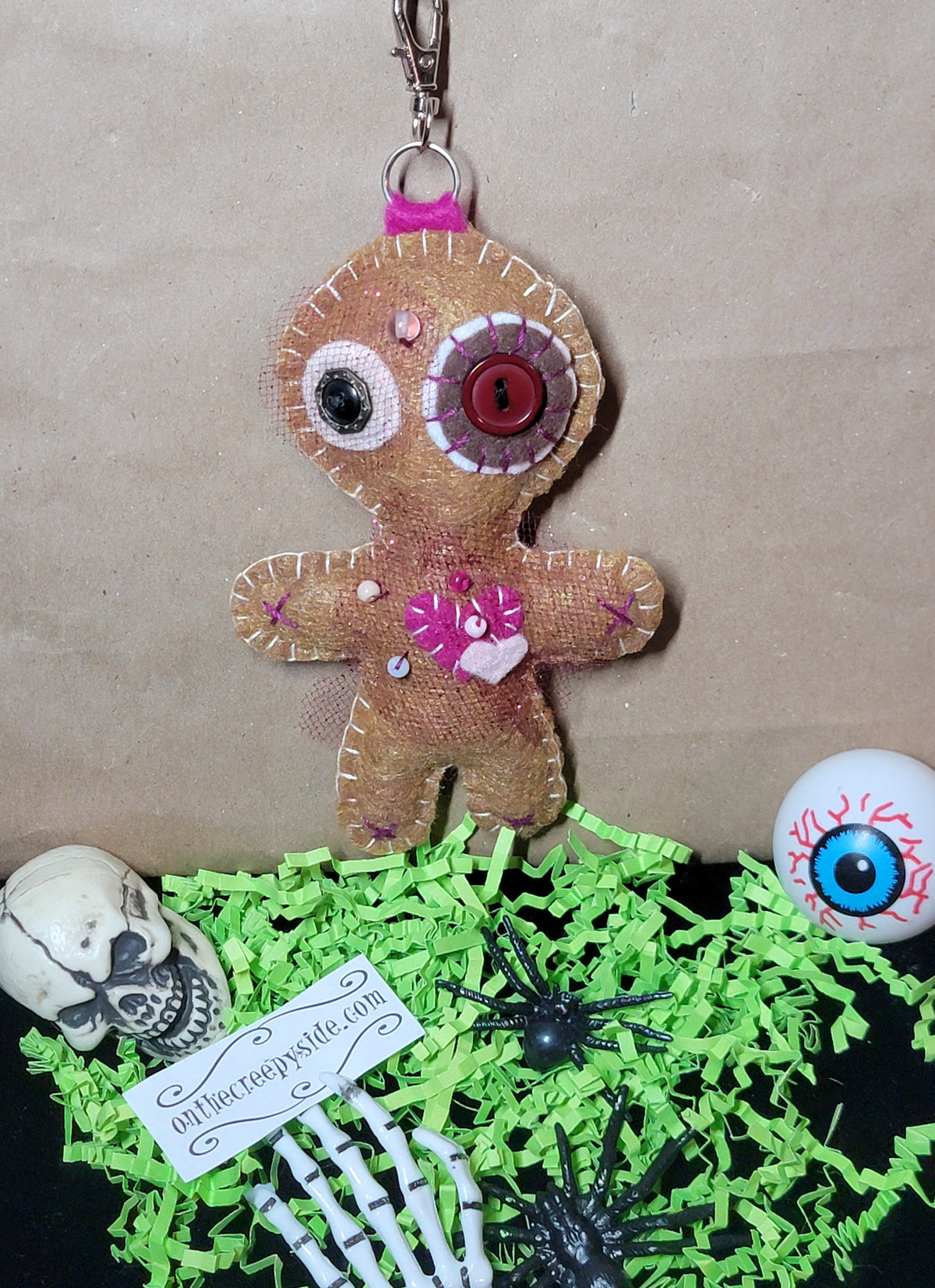 Brown and pink handmade Mini Button-Eyed Stitchling plush keychain and bag charm