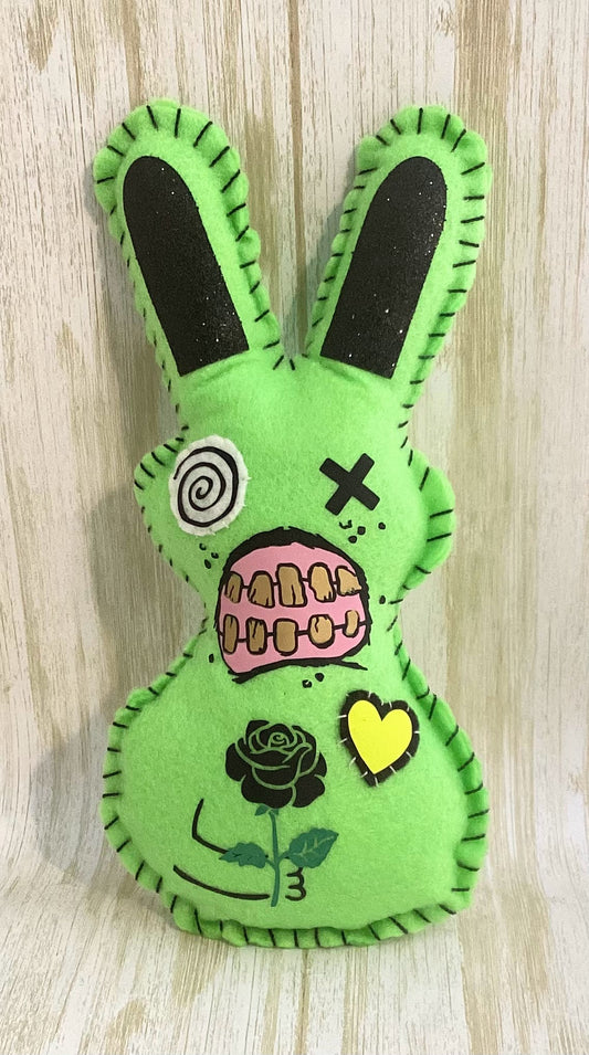 Neon Green Zombie bunny plush holding a black rose in front and a bloody knife behind his back