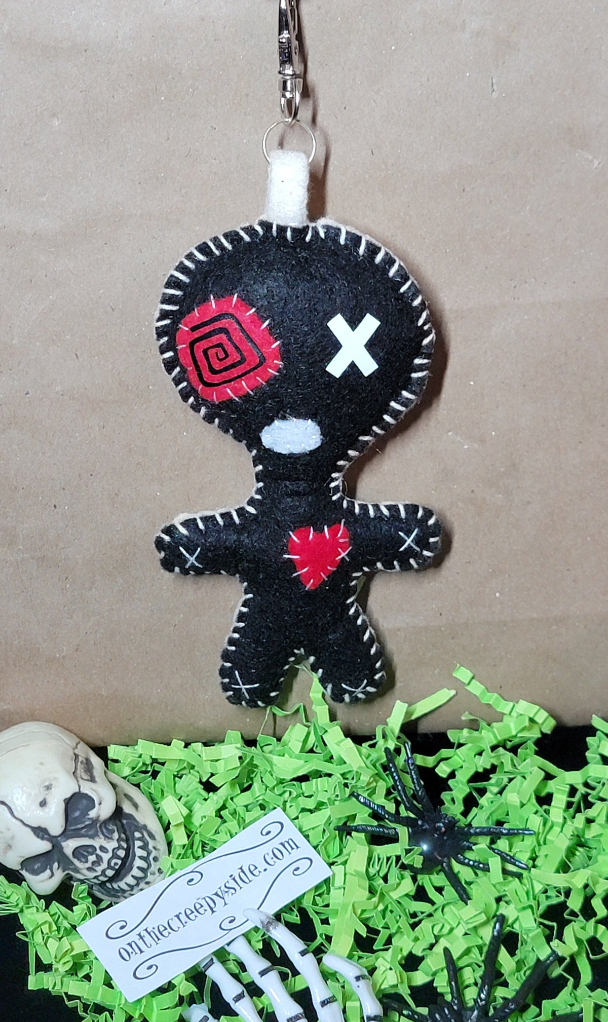 One-of-a-kind black Button-Eyed Stitchling handmade felt bag charm