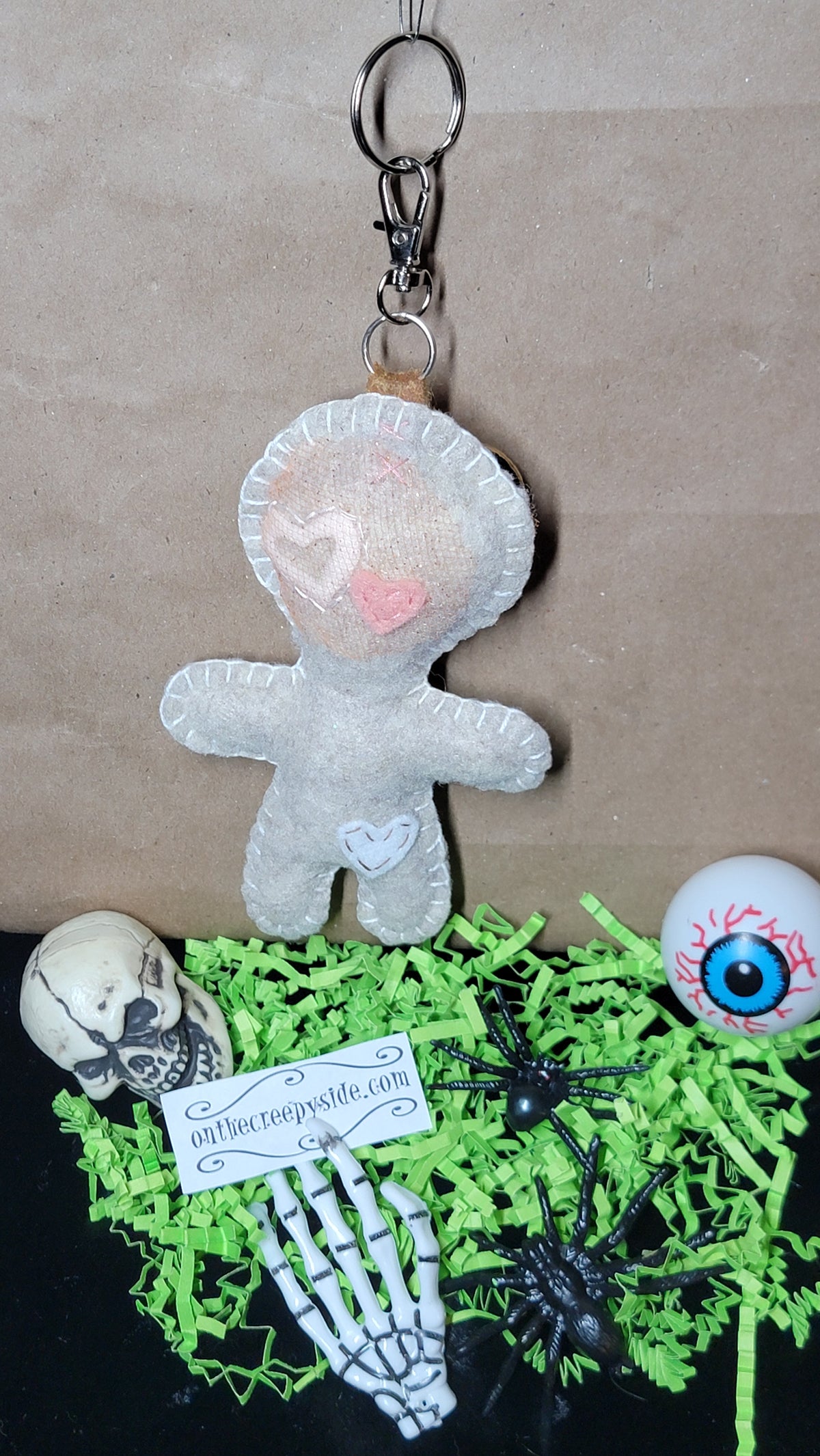 Button-Eyed Stitchling felt keychain and bag charm, ready to ship