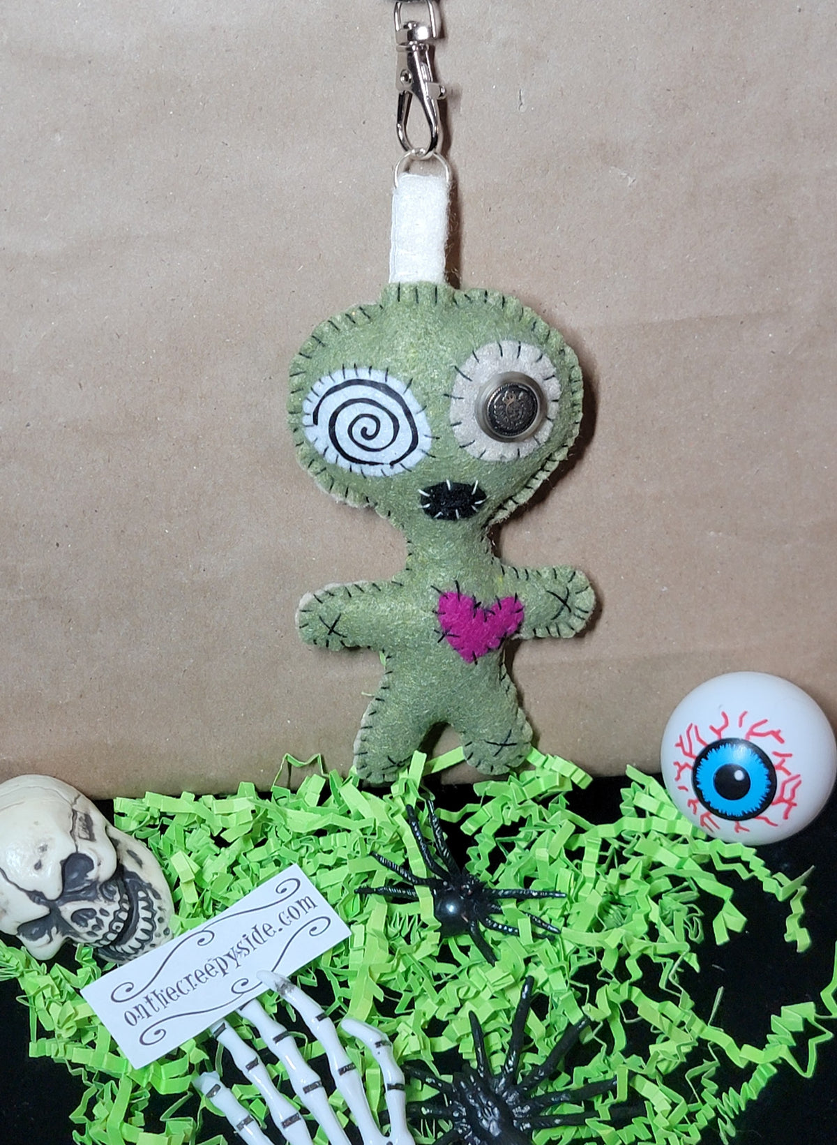 Olive green handmade Mini Button-Eyed Stitchling plush keychain and bag charm
