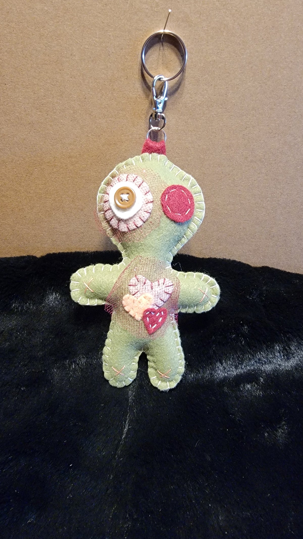 Olive green Button-Eyed Stitchling felt plush keychain with metal keyring