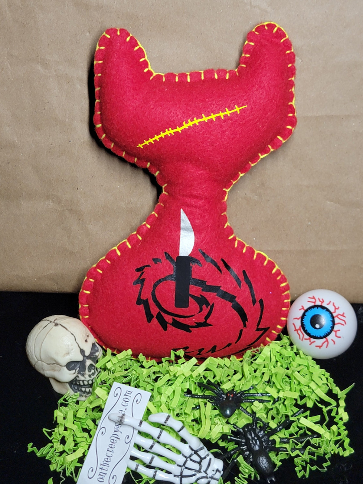 One-of-a-kind red creepy cat plush with hand-stitched details
