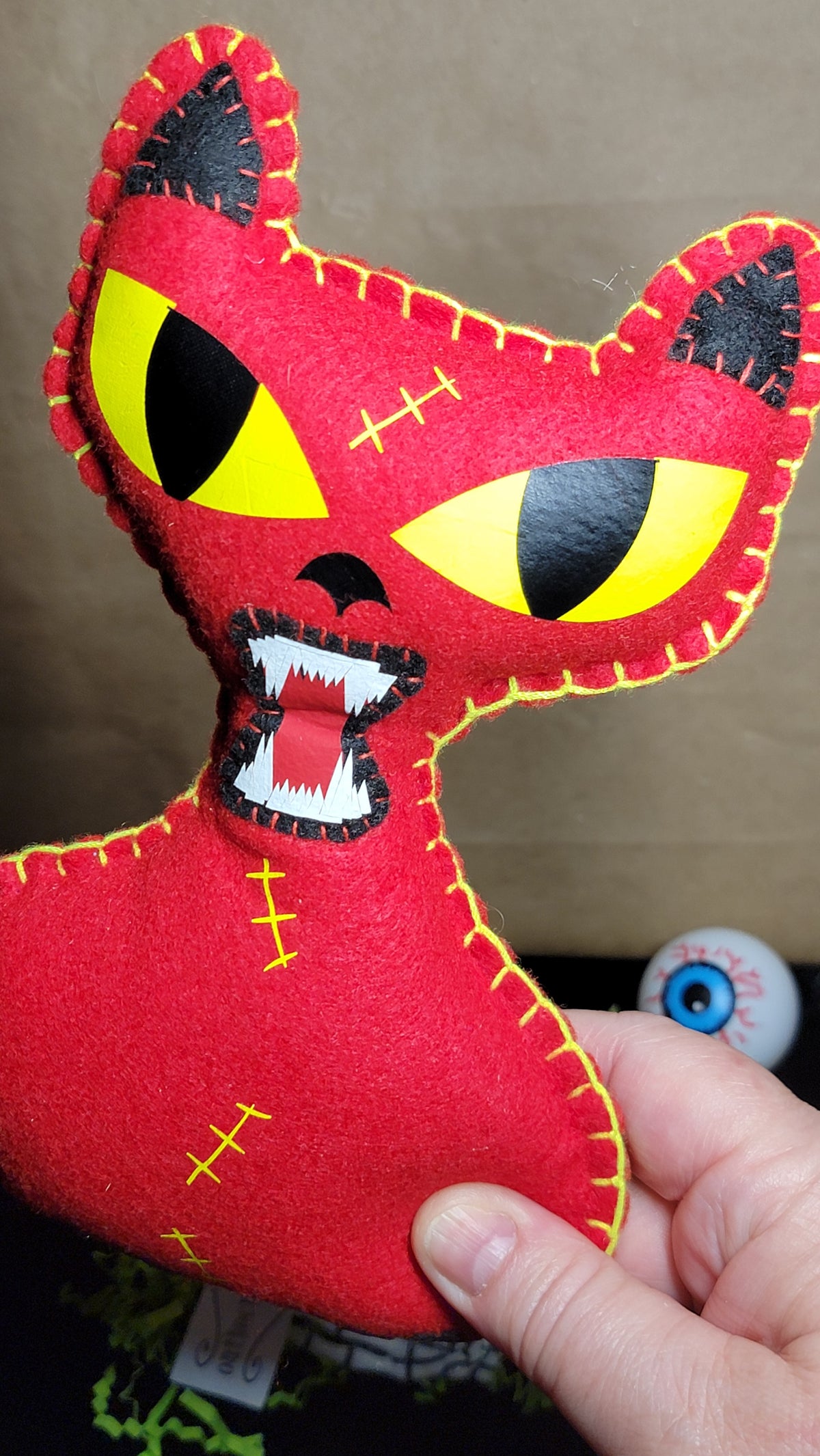 Red killer kitty plush for spooky decor and horror collections