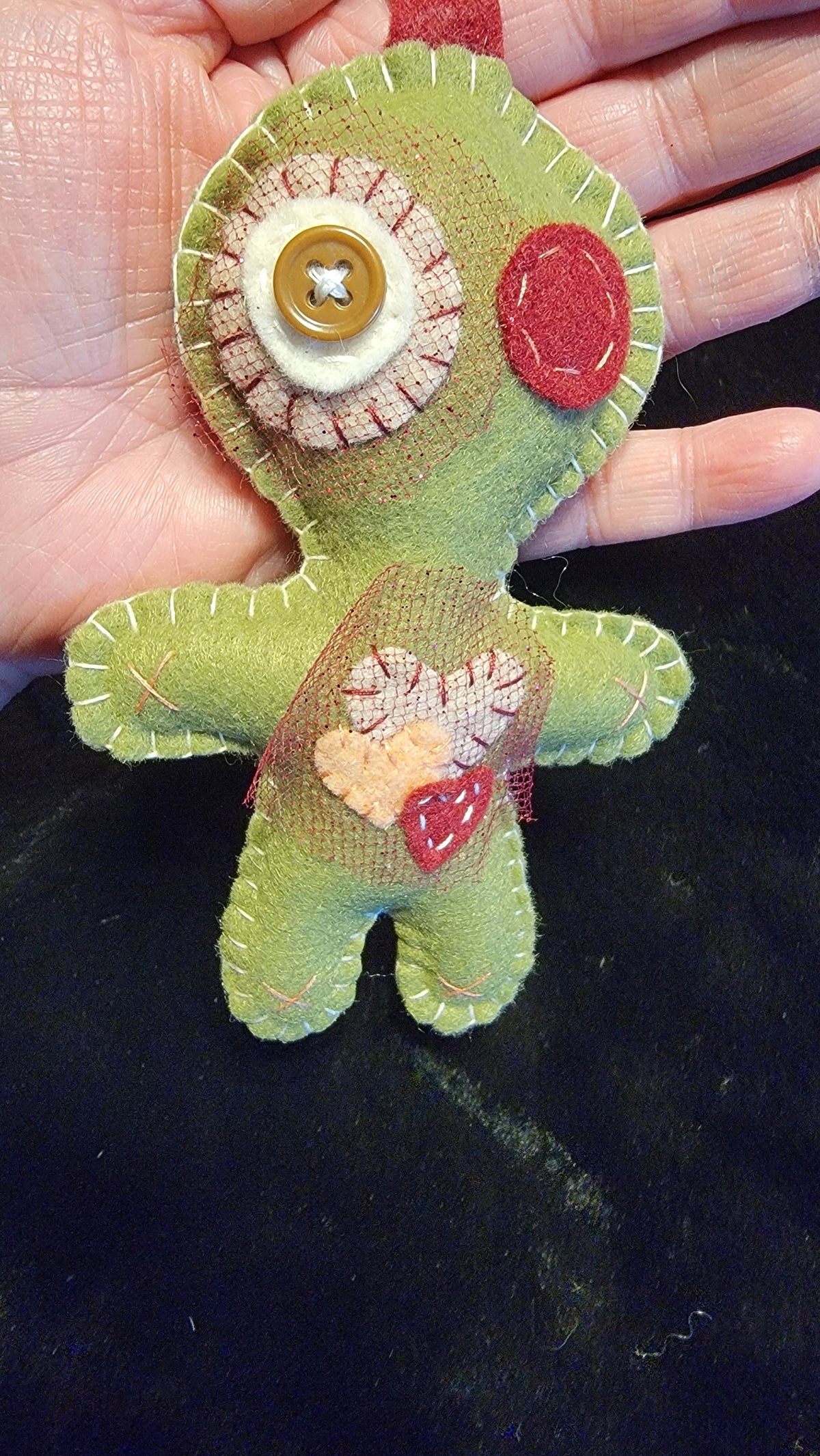 Olive green Button-Eyed Stitchling felt keychain and bag charm, ready to ship
