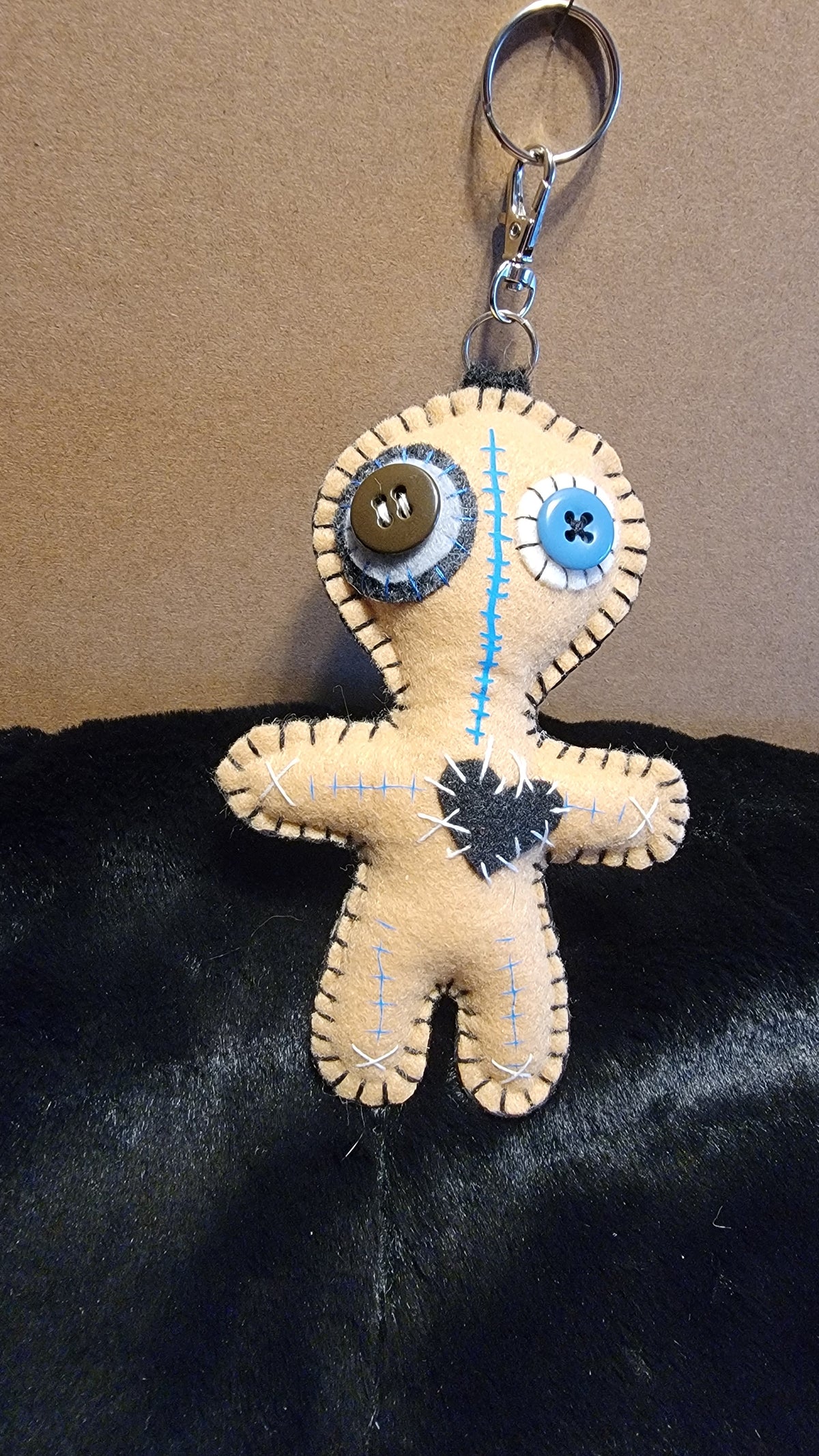 Hand-stitched felt Button-Eyed Stitchling plush keychain with metal keyring
