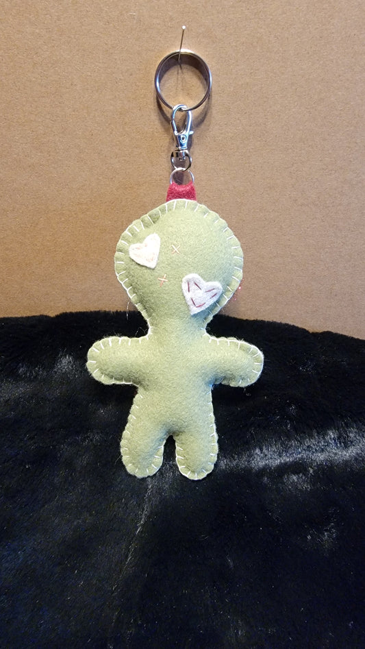 Hand-stitched olive green Button-Eyed Stitchling bag charm